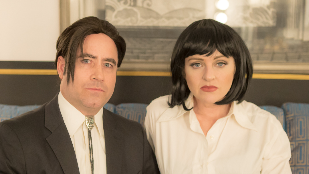 Vincent and Uma styled Pulp Fiction performers backstage at a theater