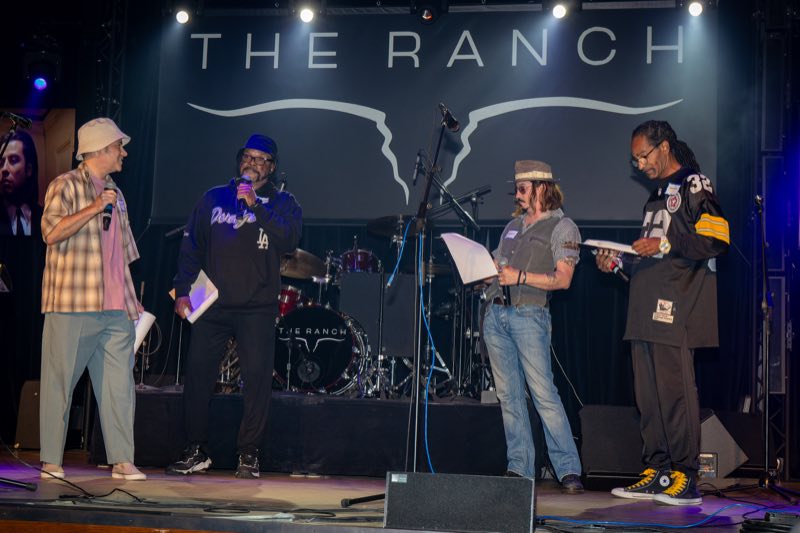 Rehearsal photo with Vincent, Jules, and additional themed characters on stage