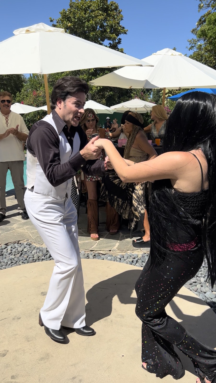 Tony inviting a VIP guest onto the dance floor during a live event performance.