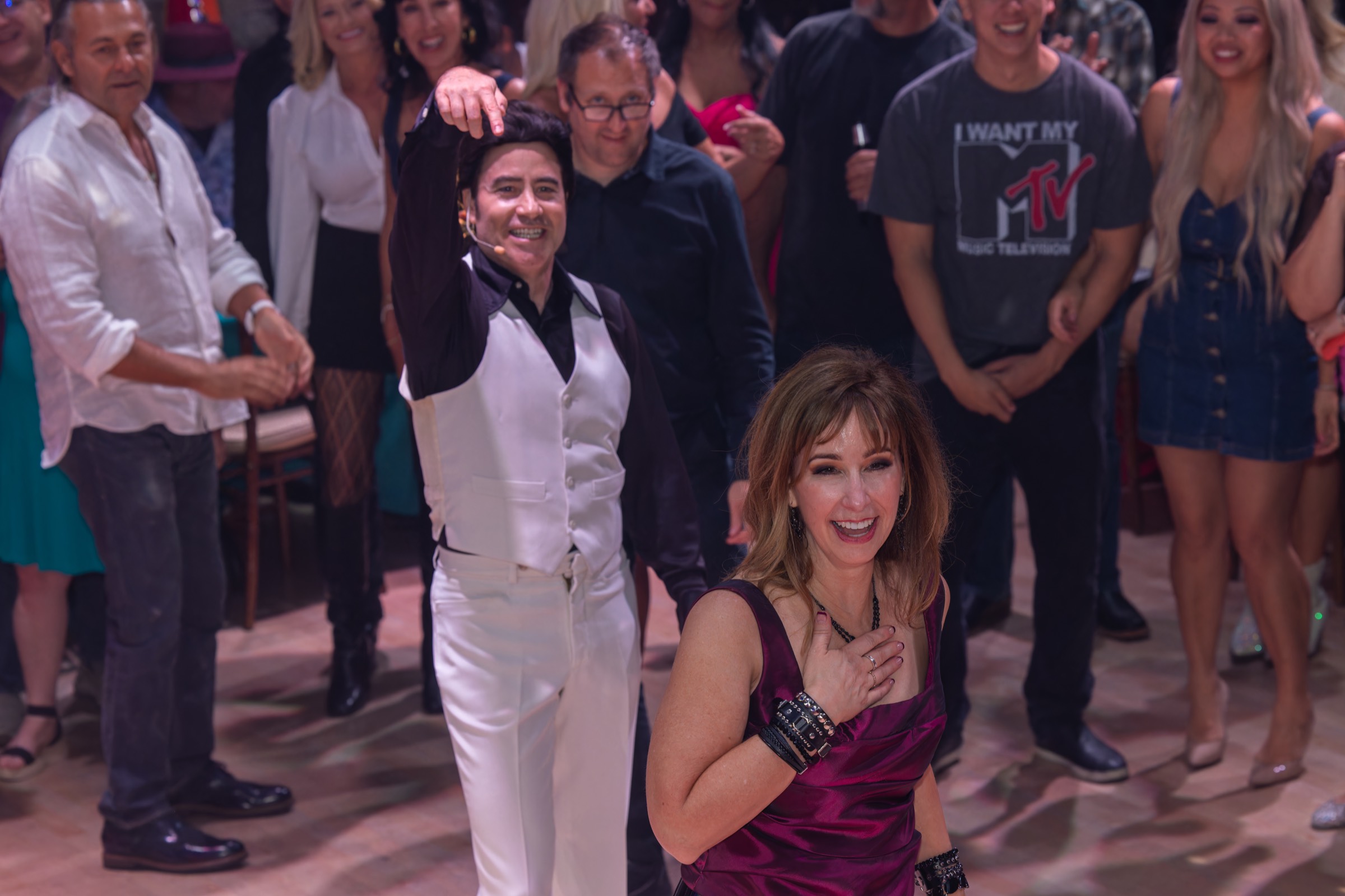 VIP guest enjoying a featured dance moment with Tony as the crowd reacts.